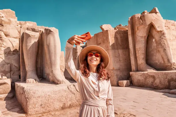 girl taking selfi in a temple