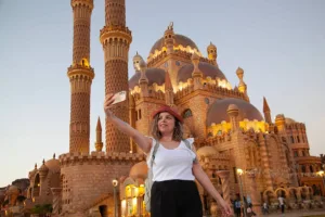 Happy tourist woman backpacker traveler take a selfie photo on Sharm El Sheikh